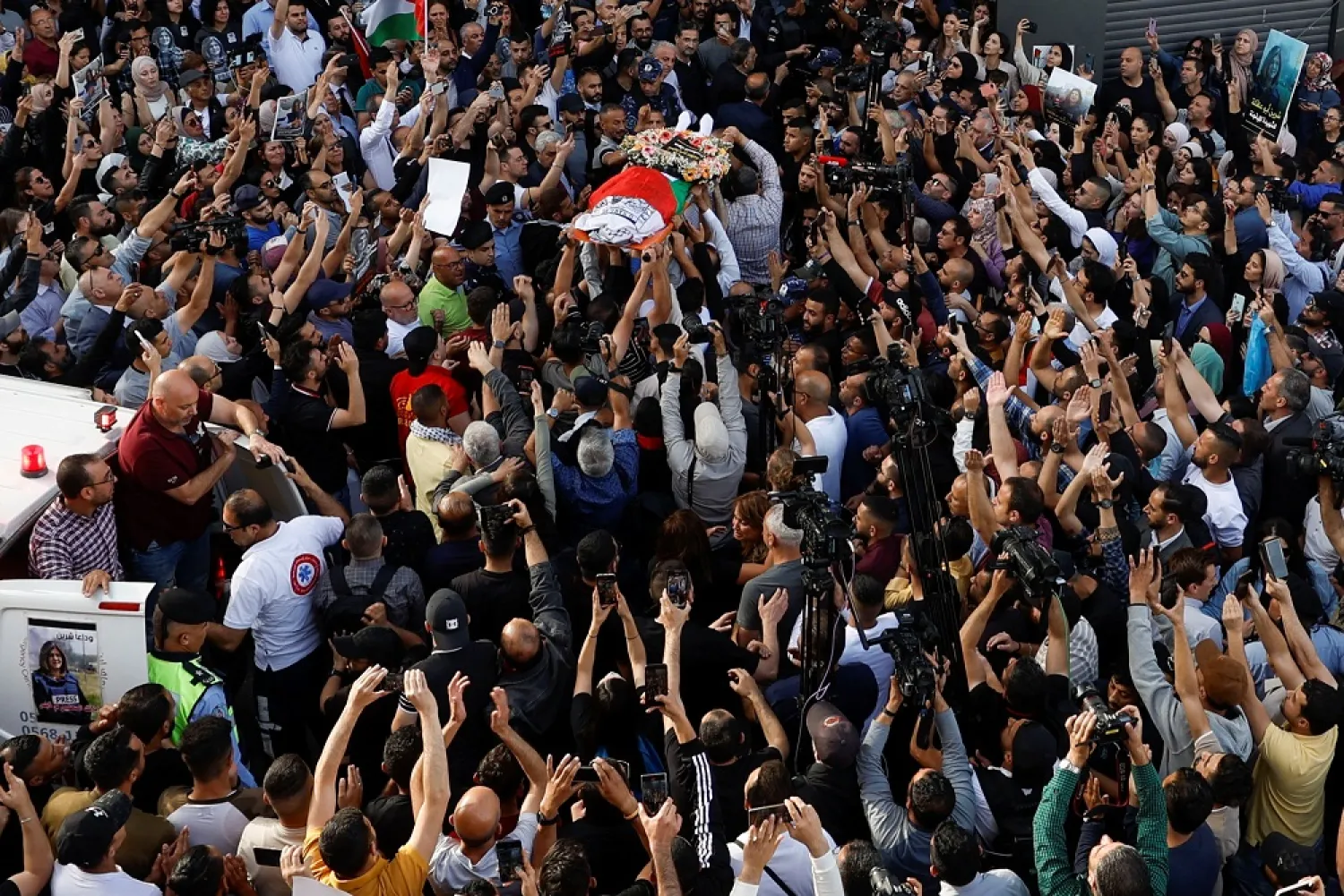 Palestinians carry the body of Al Jazeera reporter Shireen Abu Akleh, who was killed in an Israeli raid, in Ramallah, in the Israeli-occupied West Bank May 11, 2022. (Reuters)