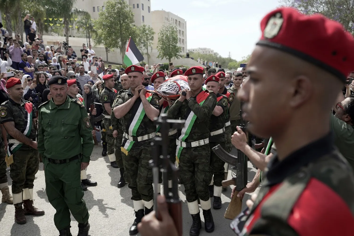 Slain Al Jazeera veteran journalist Shireen Abu Akleh is carried by a Palestinian honor guard in the West Bank city of Nablus, Wednesday, May 11, 2022. (AP)