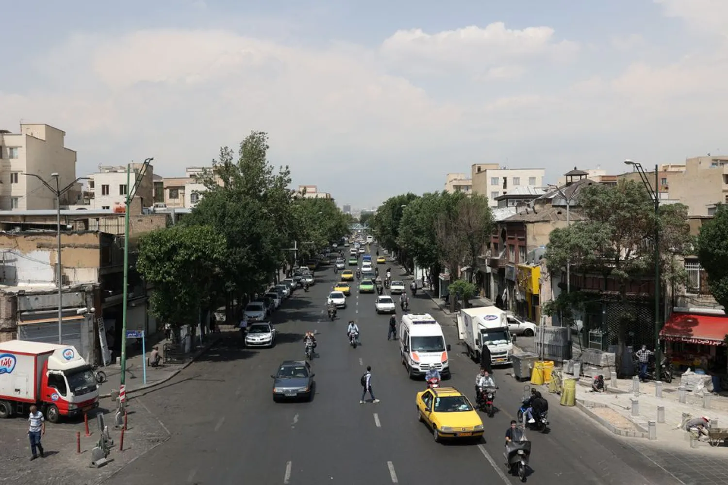 Cars drive along a street in Tehran, Iran May 1, 2022. Majid Asgaripour/WANA (West Asia News Agency) via REUTERS