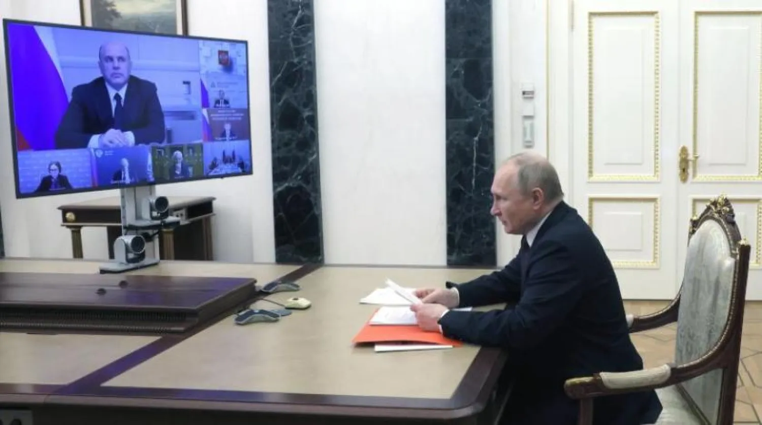 Russian President Vladimir Putin attends a meeting on economic issues via videoconference at the Kremlin in Moscow, Russia, Thursday, May 12, 2022. (Mikhail Metzel, Sputnik, Kremlin Pool Photo via AP)