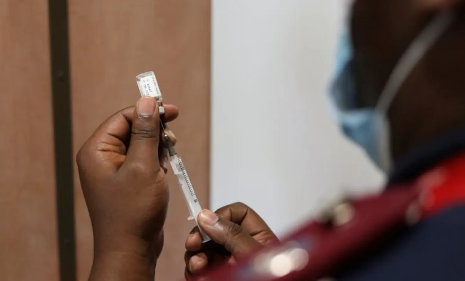 A nurse prepares a dose of the coronavirus disease (COVID-19) vaccine as the new Omicron variant spreads, in Dutywa, in the Eastern Cape province, South Africa November 29, 2021. REUTERS/Siphiwe Sibeko