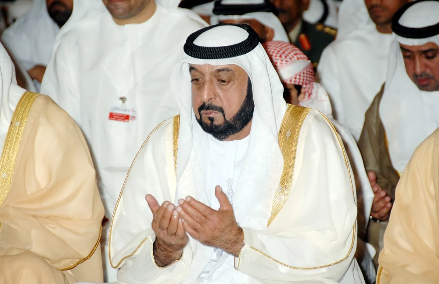 An undated handout photo made available by the official Emirati News Agency (WAM) on 13 May 2022 shows the late President Sheikh Khalifa bin Zayed Al Nahyan performing a prayer. (WAM)