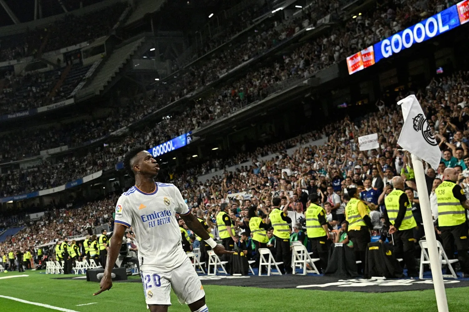 Real Madrid's Brazilian forward Vinicius Junior celebrates scoring his third goal, his team's sixth goal, during the Spanish league football match between Real Madrid CF and Levante UD at the Santiago Bernabeu stadium in Madrid on May 12, 2022. (AFP)