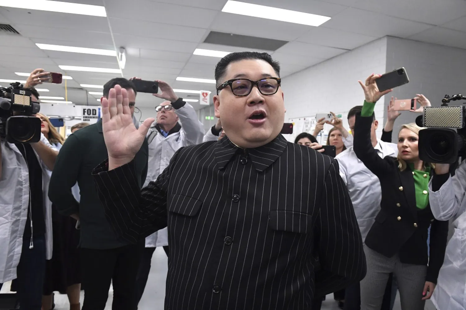 A man impersonating North Korea's leader Kim Jong-un arrives as Prime Minister Scott Morrison leaves Extel Technologies manufacturing facility on Day 33 of the 2022 federal election campaign, in Melbourne, Australia, Friday, May 13, 2022. (AP)