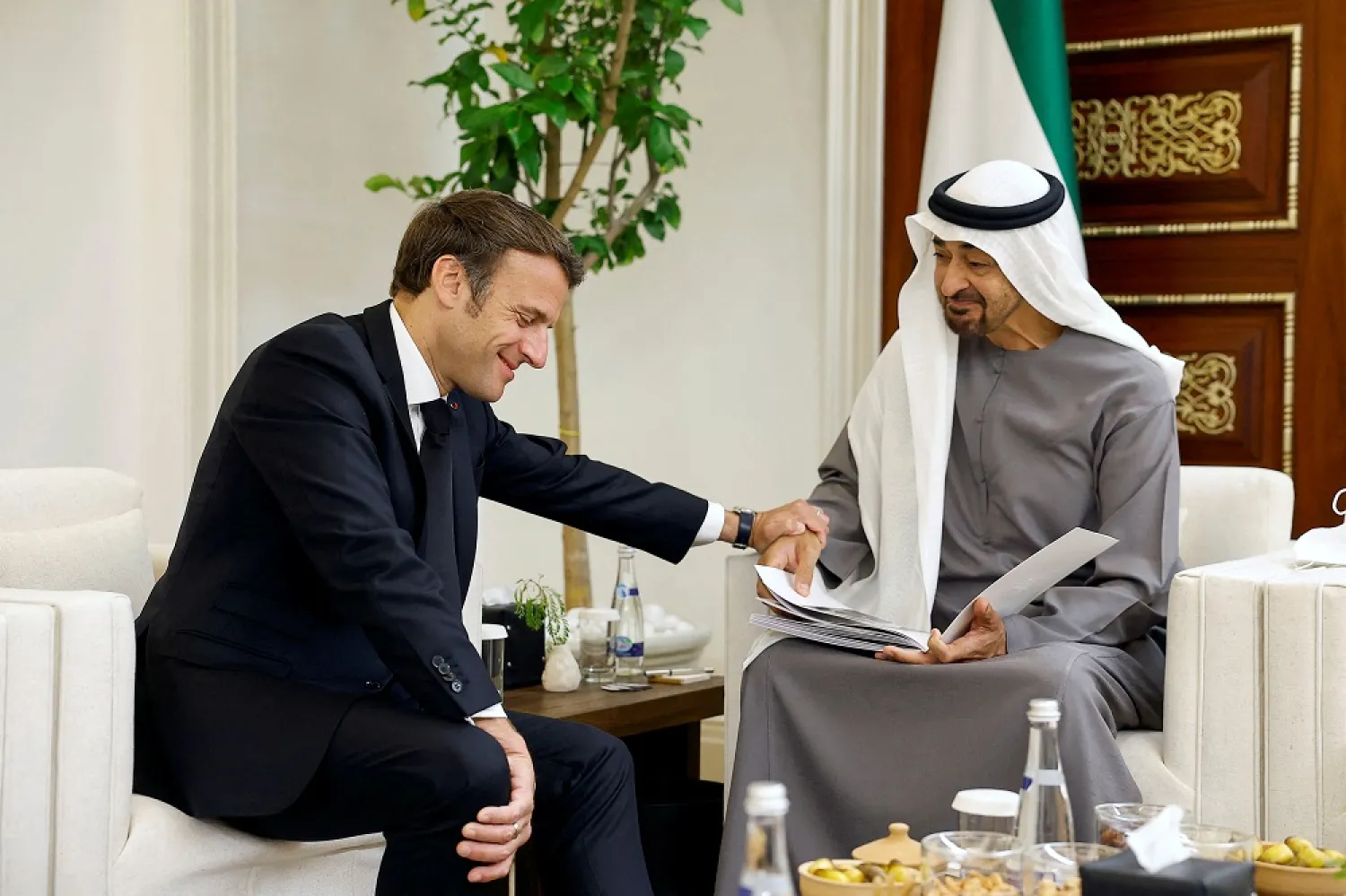 French President Emmanuel Macron meets newly-elected president of the United Arab Emirates Sheikh Mohammed bin Zayed Al Nahyan to mourn the death of Sheikh Khalifa bin Zayed Al Nahyan at Al Mushrif Palace in Abu Dhabi, United Arab Emirates, May 15, 2022. (Reuters)