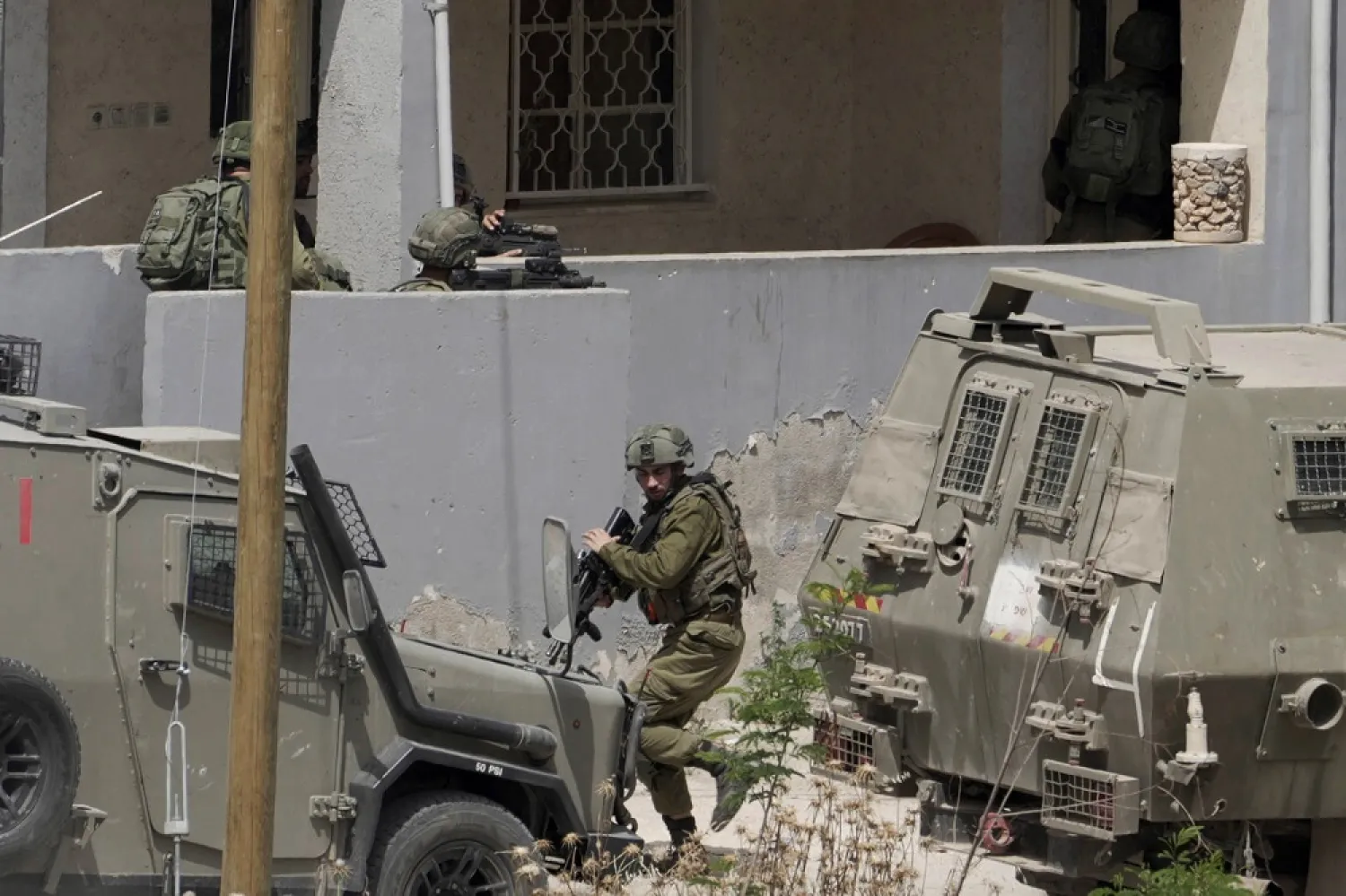 Israeli soldiers conduct an operation in the West Bank town of Jenin, Friday, May 13, 2022. (AP)