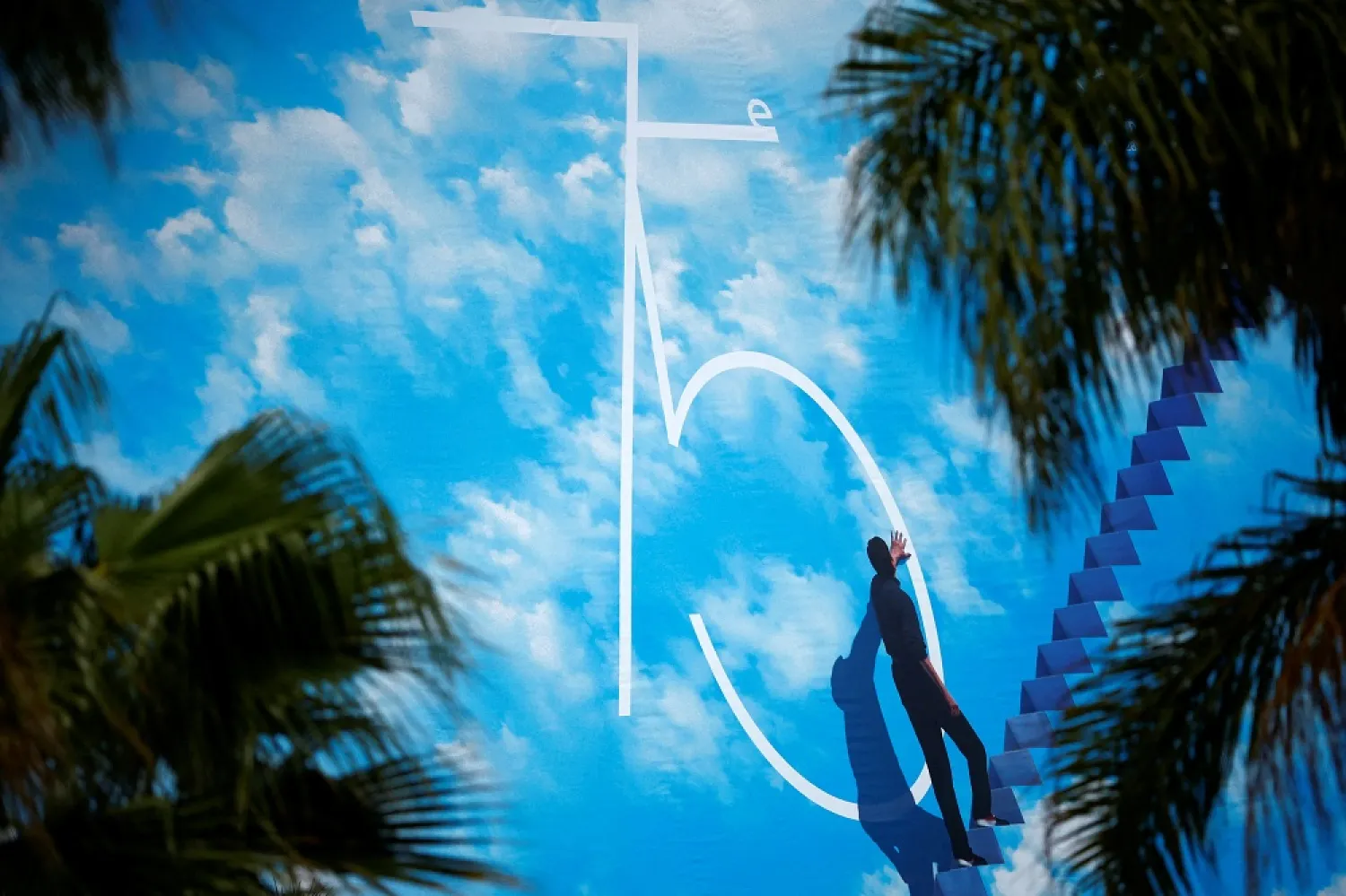 The 75th Cannes Film Festival - Cannes, France, May 16, 2022. A view shows a giant canvas of the official poster featuring actor Jim Carrey in the film The Truman Show, on the facade of the Festival Palace on the eve of the opening ceremony. (Reuters)