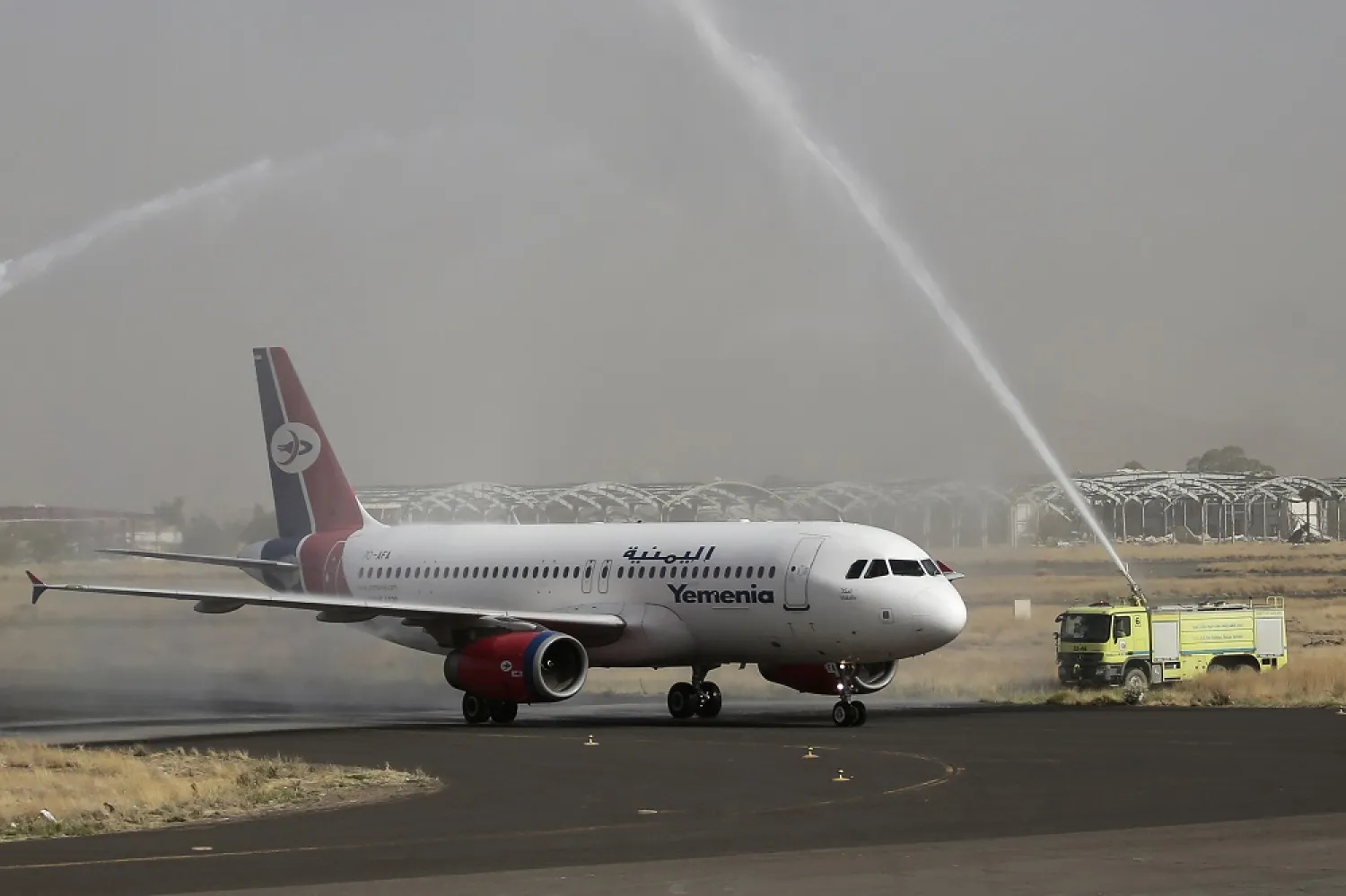 16 May 2022, Yemen, Sanaa: A Yemen Airways plane is welcomed with a water salute at the Sanaa international airport. (dpa)