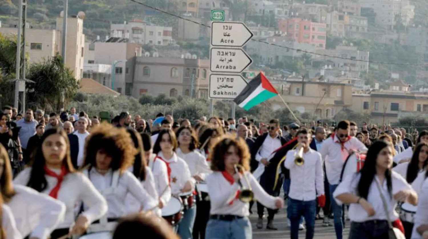  İsrailli Araplar, Celile’nin kuzeyindeki Deir Hanna’da Toprak Günü’nün 46’ıncı yıl dönümünü kutlamak için yürüdü. (AFP)
