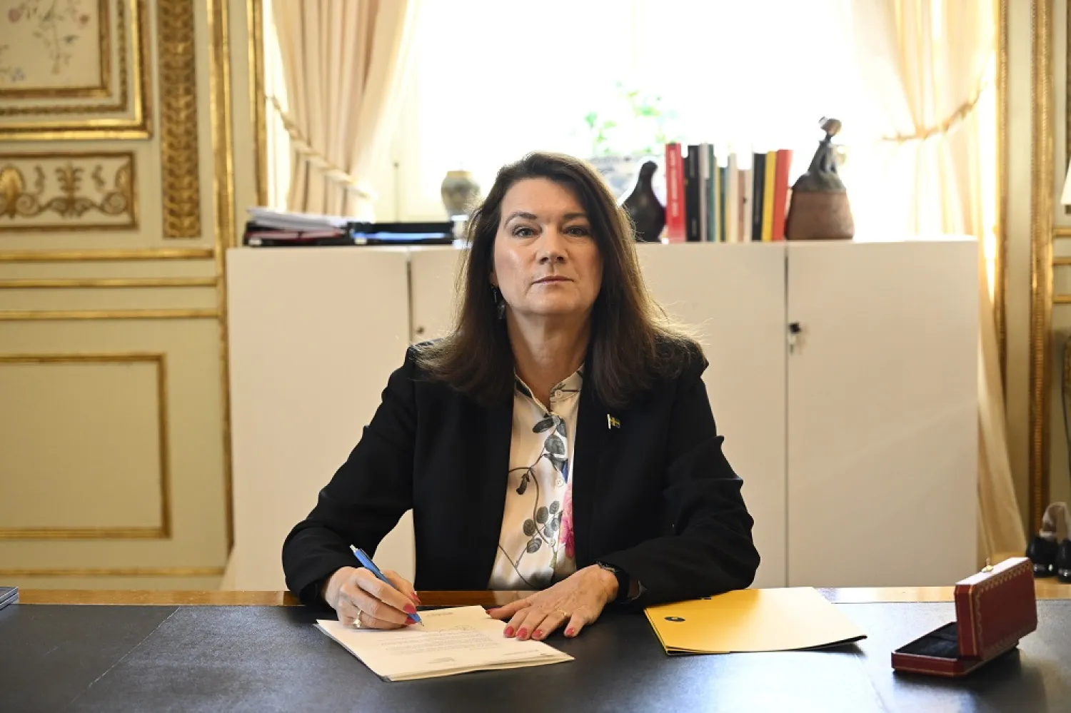 Sweden's Minister of Foreign Affairs Ann Linde signs Sweden's application for NATO membership at the Ministry of Foreign Affairs in Stockholm, Sweden, 17 May 2022. (EPA)