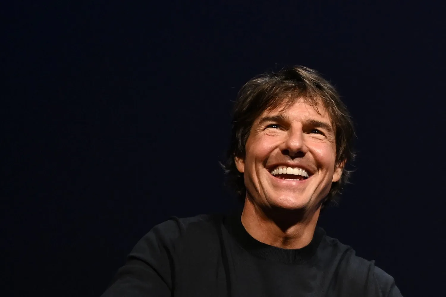 US actor Tom Cruise smiles during a "Rendez-Vous With Tom Cruise" at the 75th edition of the Cannes Film Festival in Cannes, southern France, on May 18, 2022. (AFP)