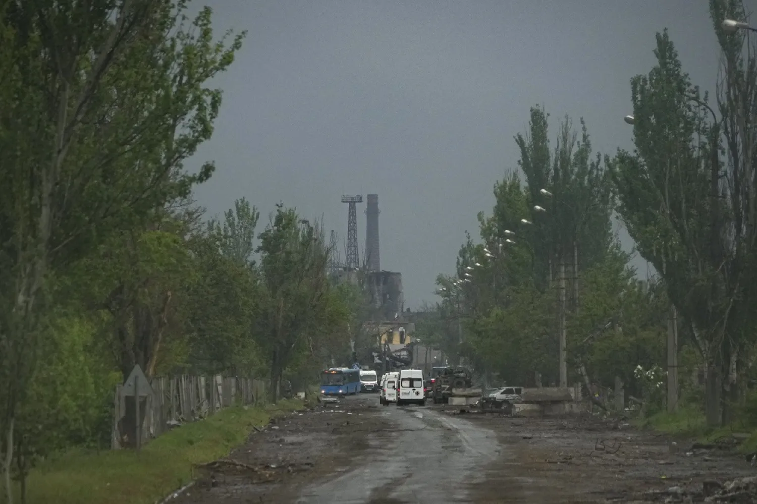 Buses and ambulances are seen near the besieged Azovstal steel plant during an evacuation in Mariupol, in territory under the government of the Donetsk People's Republic, eastern Ukraine, Wednesday, May 18, 2022. (AP)