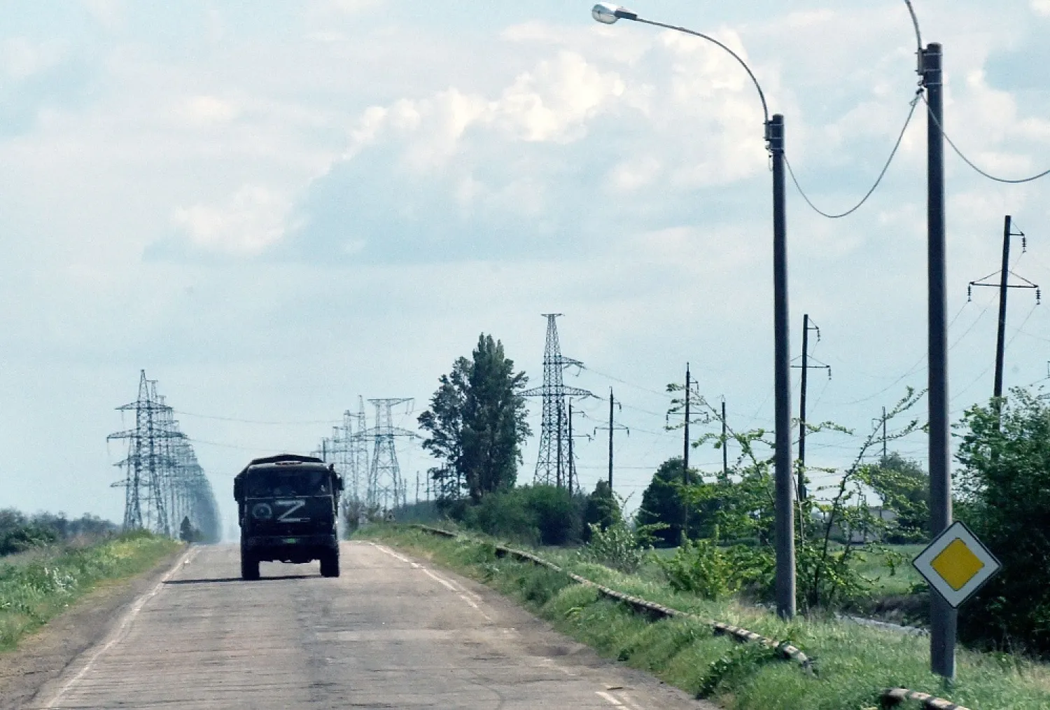 A Russian military truck painted with the letter Z moves on a road in the Kherson region on May 19, 2022, amid the ongoing Russian military action in Ukraine. (AFP)