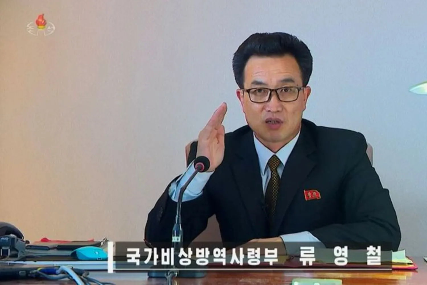 Ryu Yong Chol, an official at North Korea's state emergency epidemic prevention headquarters, speaks during a daily coronavirus program on state-run television KRT, in this still image obtained from KRT footage released on May 20, 2022. (KRT via Reuters)