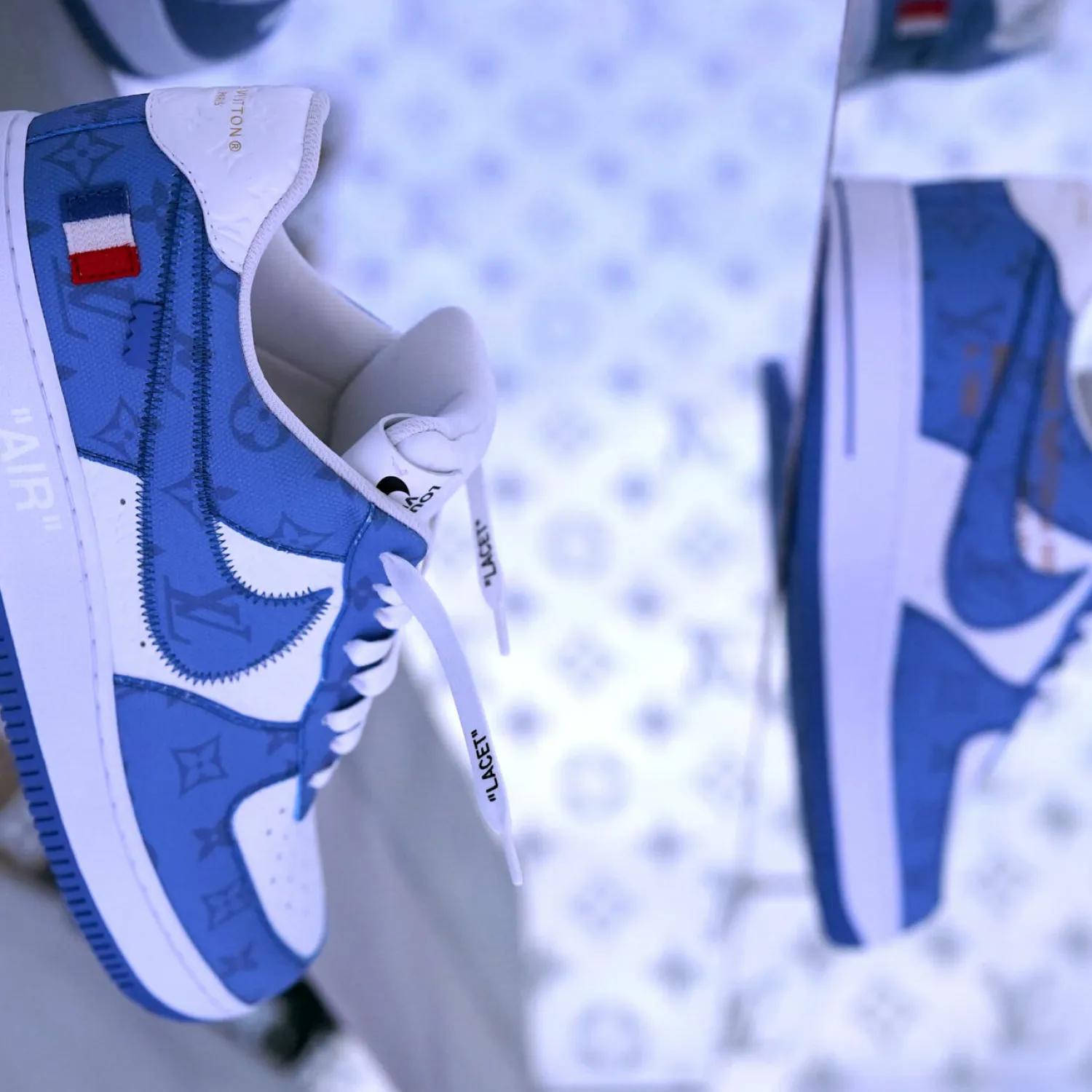 A pair of shoes during an immersive exhibition showcasing 47 limited editions of the Nike ”Air Force 1” sneaker created by Virgil Abloh in partnership with Nike for Louis Vuitton May 20, 2022 at the Greenpoint Terminal Warehouse in Brooklyn, New York TIMOTHY A. CLARY AFP
