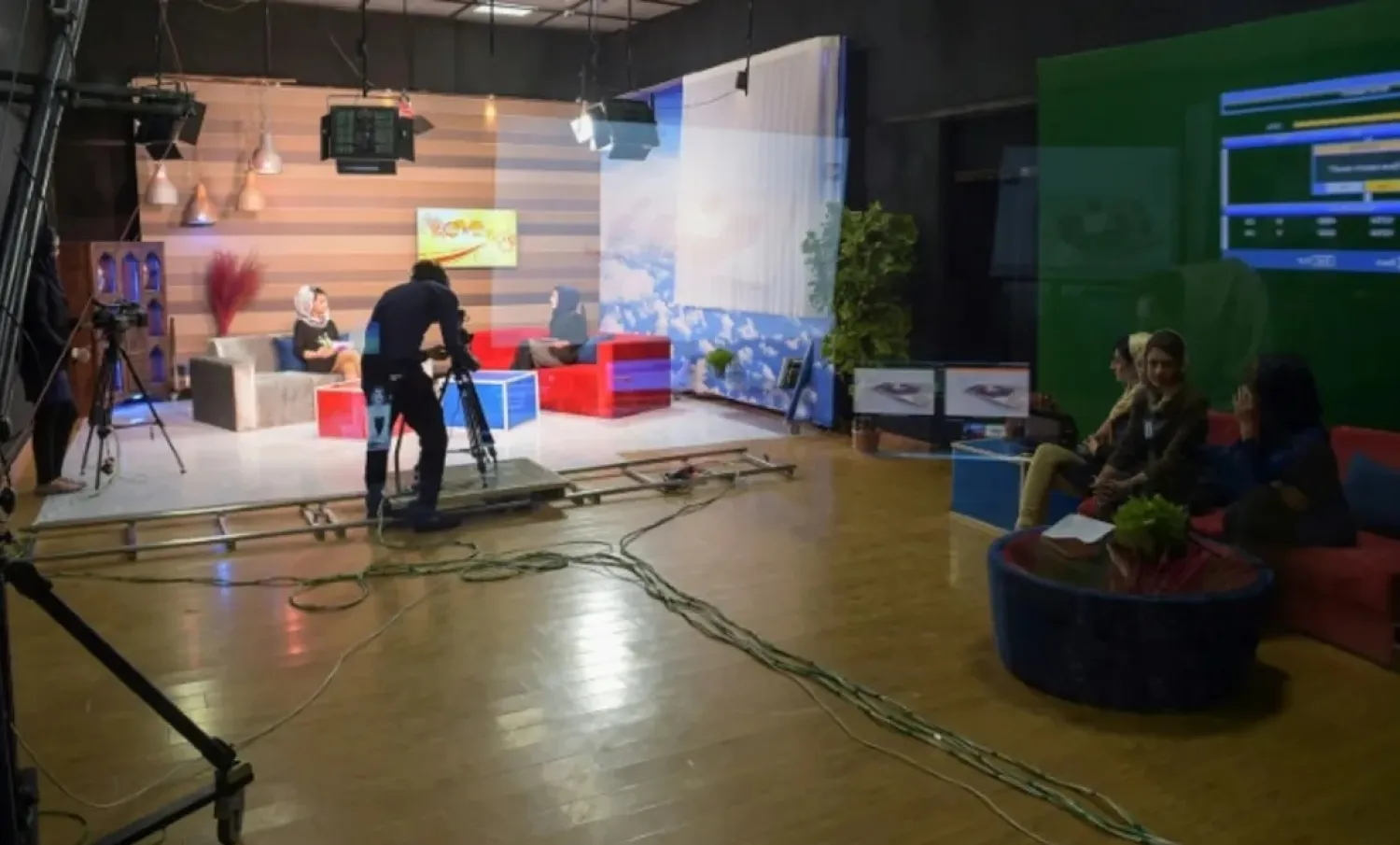 Afghan presenters record a morning TV program in Kabul in 2017. (AFP)