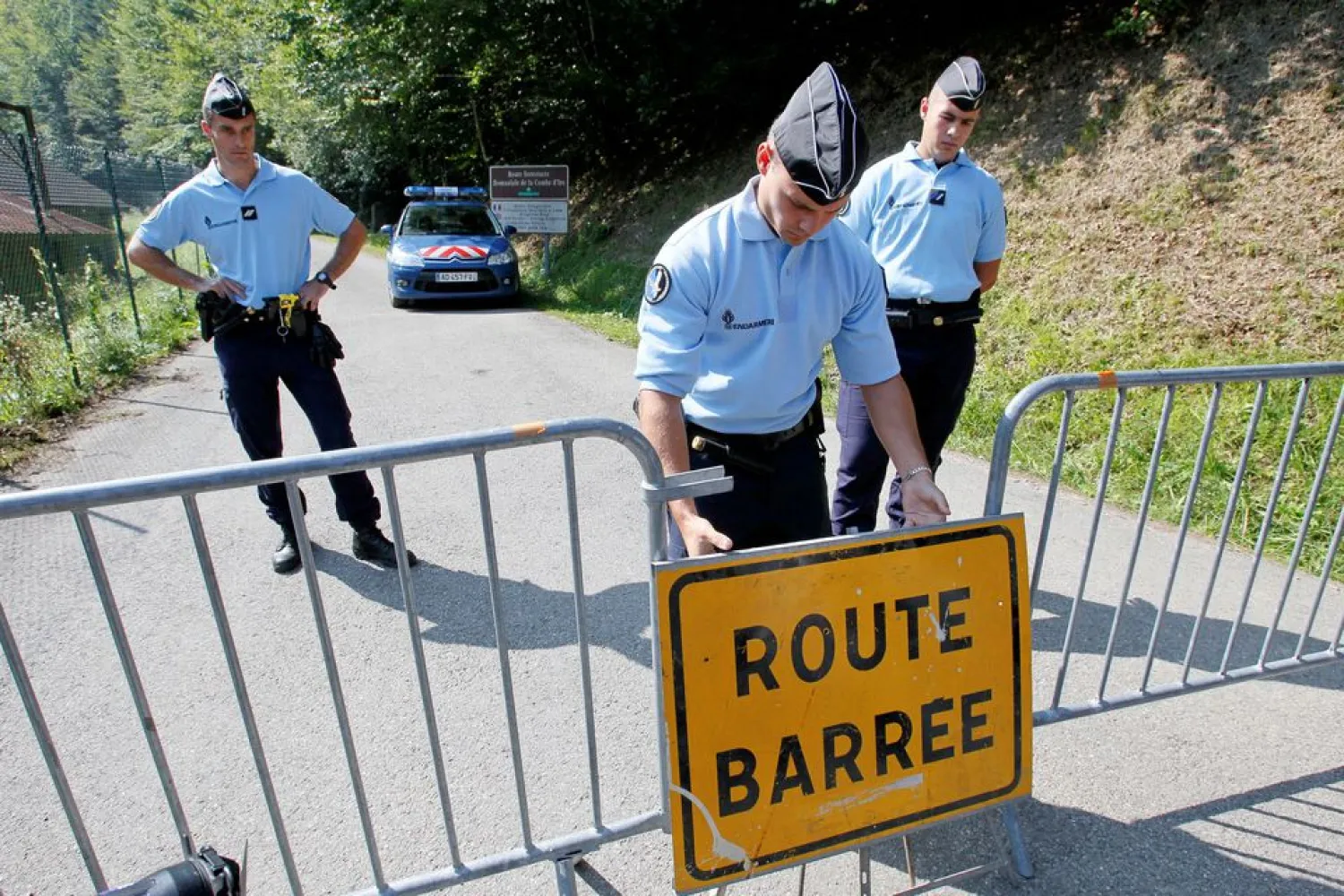 French gendarmes block access to a road in southeastern France, September 6, 2012. REUTERS/Robert Pratta