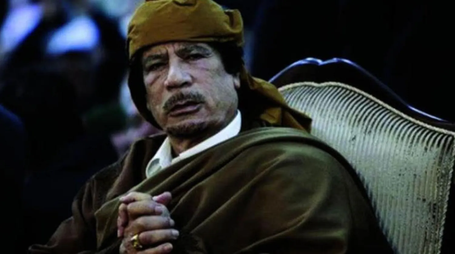 الرئيس الليبي الراحل معمر القذافي (رويترز)