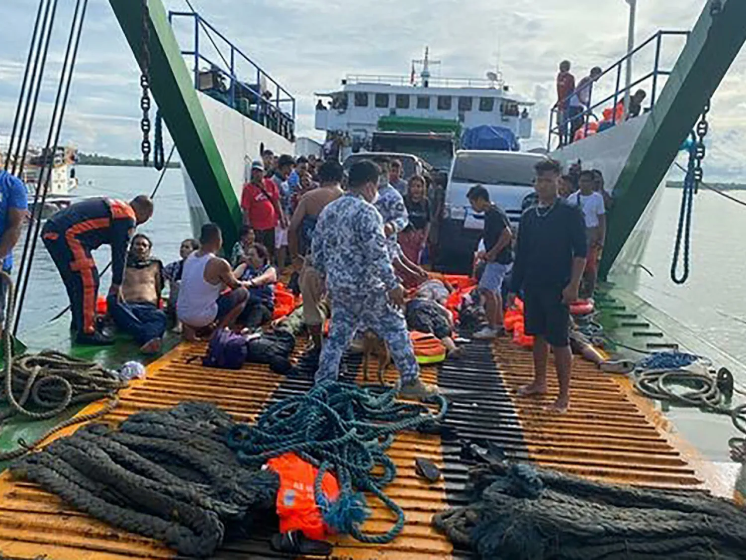 At least seven people were killed and scores plucked to safety in the Philippines on May 23 after a fire ripped through a ferry and forced passengers to jump overboard, coast guard and witnesses say Handout Philippine Coastguard/AFP
