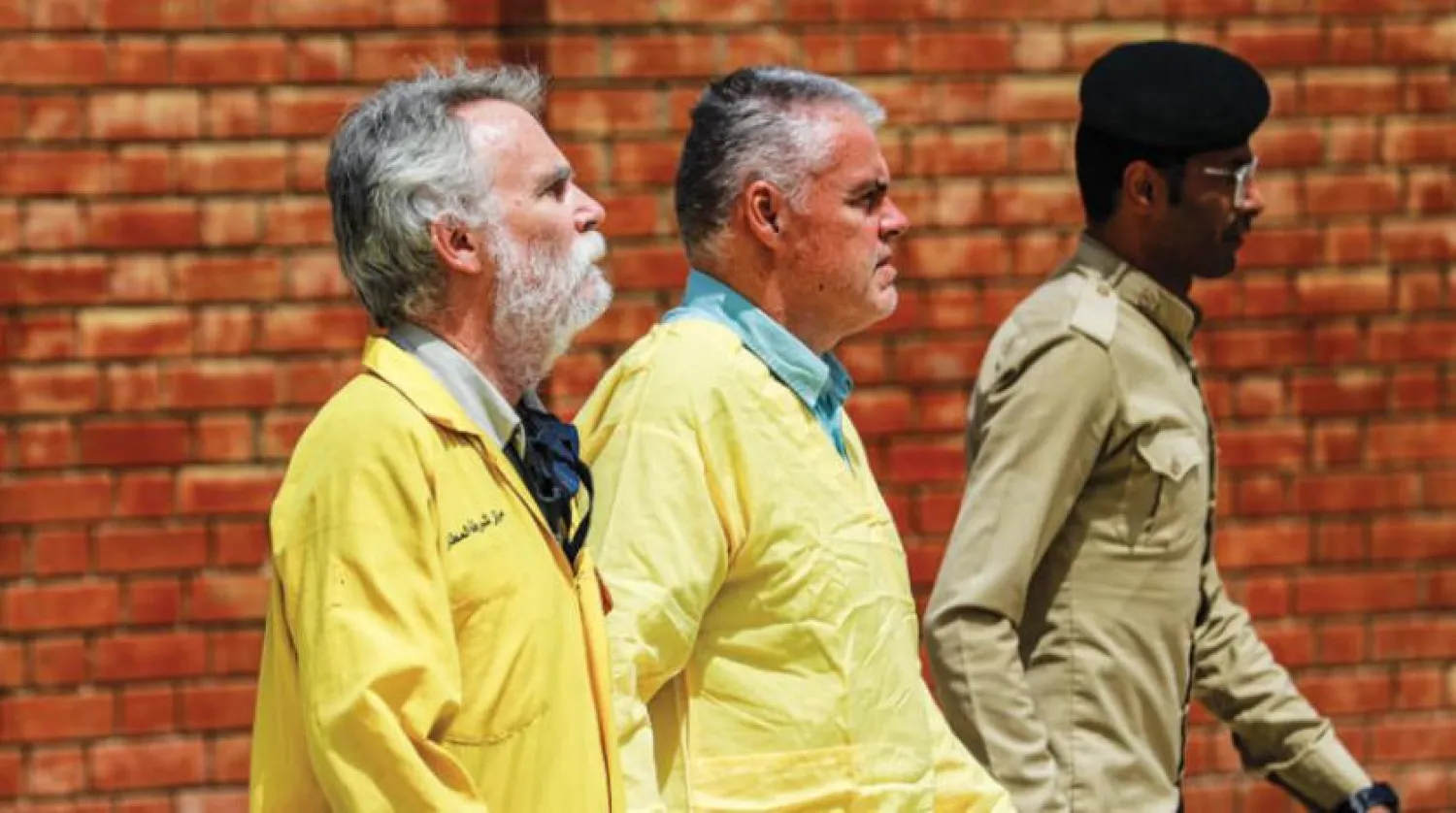 James Fitton (L), a retired British geologist, and Volker Waldmann (C), a Berlin psychologist, leave Baghdad/Karkh Federal Appeal Court after attending an appeal hearing. Photo: Ameer Al-Mohammedawi/dpa