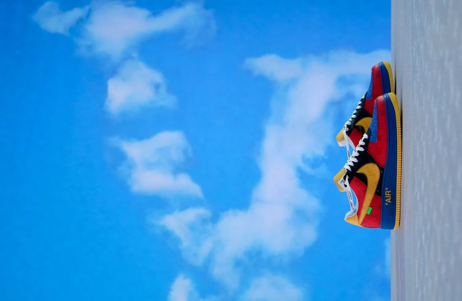 A pair of shoes during a immersive exhibition showcasing 47 limited editions of the Nike "Air Force 1" sneaker created by Virgil Abloh in partnership with Nike for Louis Vuitton May 20, 2022 at the Greenpoint Terminal Warehouse in Brooklyn, New York. (AFP)