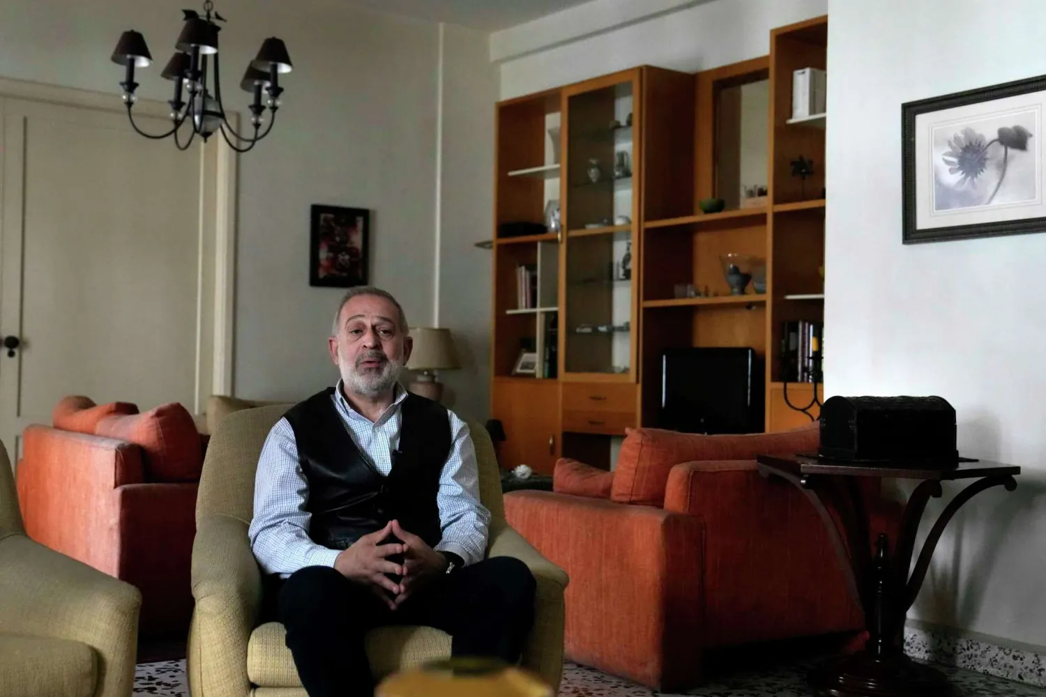 Ramy Finge, a dentist spent two years braving tear gas and rubber bullets during anti-government protests, is one of 13 independent newcomers who won a seat in the latest parliamentary elections, speaks during an interview with The Associated Press, at his home in Tripoli, north Lebanon, Tuesday, May 24, 2022. Hussein Malla/AP