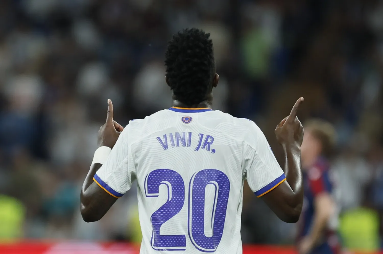Real Madrid's Vinícius Júnior celebrates after scoring the 6-0 lead during the Spanish La Liga match between Real Madrid and Levante UD in Madrid, Spain, 12 May 2022. (EPA)