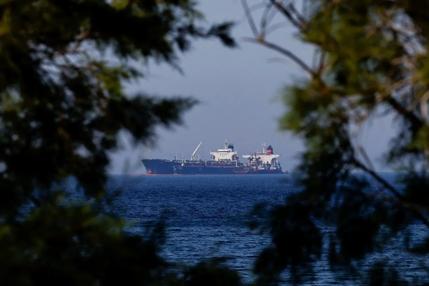 The Liberian-flagged oil tanker Ice Energy transfers crude oil from the Iranian-flagged oil tanker Lana (former Pegas), off the shore of Karystos, on the Island of Evia, Greece, May 26, 2022. (Reuters)