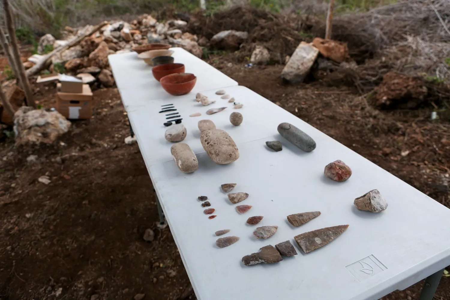 Vases, pots and tools are displayed after being discovered in the ruins of a Mayan site, called Xiol, after archaeologists have uncovered an ancient Mayan city filled with palaces, pyramids and plazas on a construction site of what will become an industrial park in Kanasin, near Merida, Mexico May 26, 2022. Picture taken May 26, 2022. (Reuters)