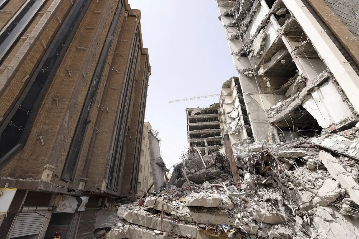 In this photo released by official website of the office of Iranian Senior Vice-President, on Friday, May 27, 2022, ruins of a tower at under construction 10-story Metropol Building remains after it collapsed on Monday, in the southwestern city of Abadan, Iran. (Iranian Senior Vice-President Office via AP) 