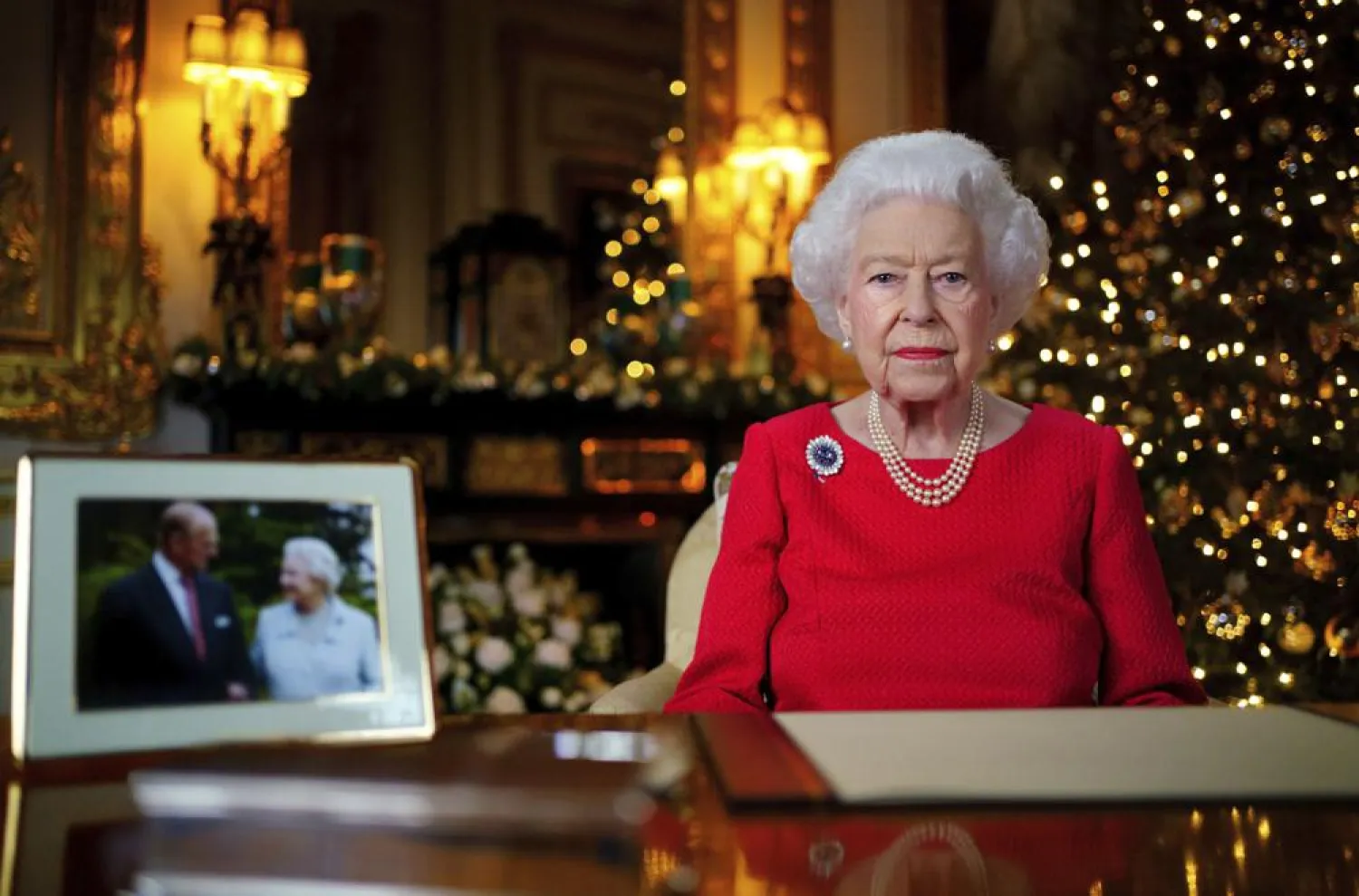 FILE - In this undated photo issued on Dec. 23, 2021, Britain's Queen Elizabeth II records her annual Christmas broadcast in Windsor Castle, Windsor, England. (Victoria Jones/Pool Photo via AP, File)
