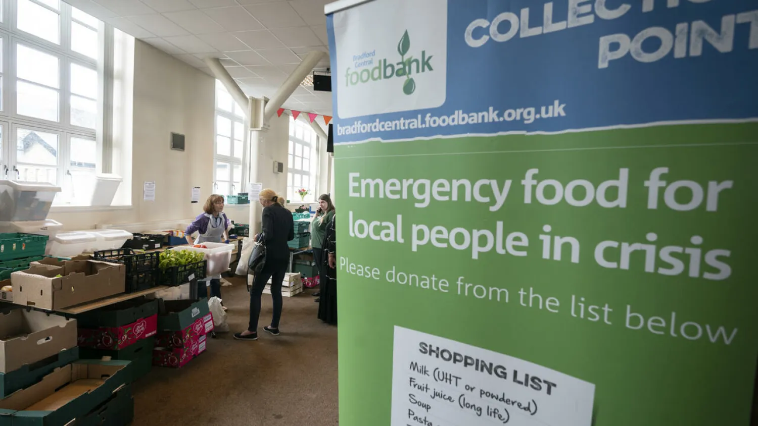 Soaring inflation, energy and food prices have seen a surge in users at foodbanks across the UK OLI SCARFF AFP
