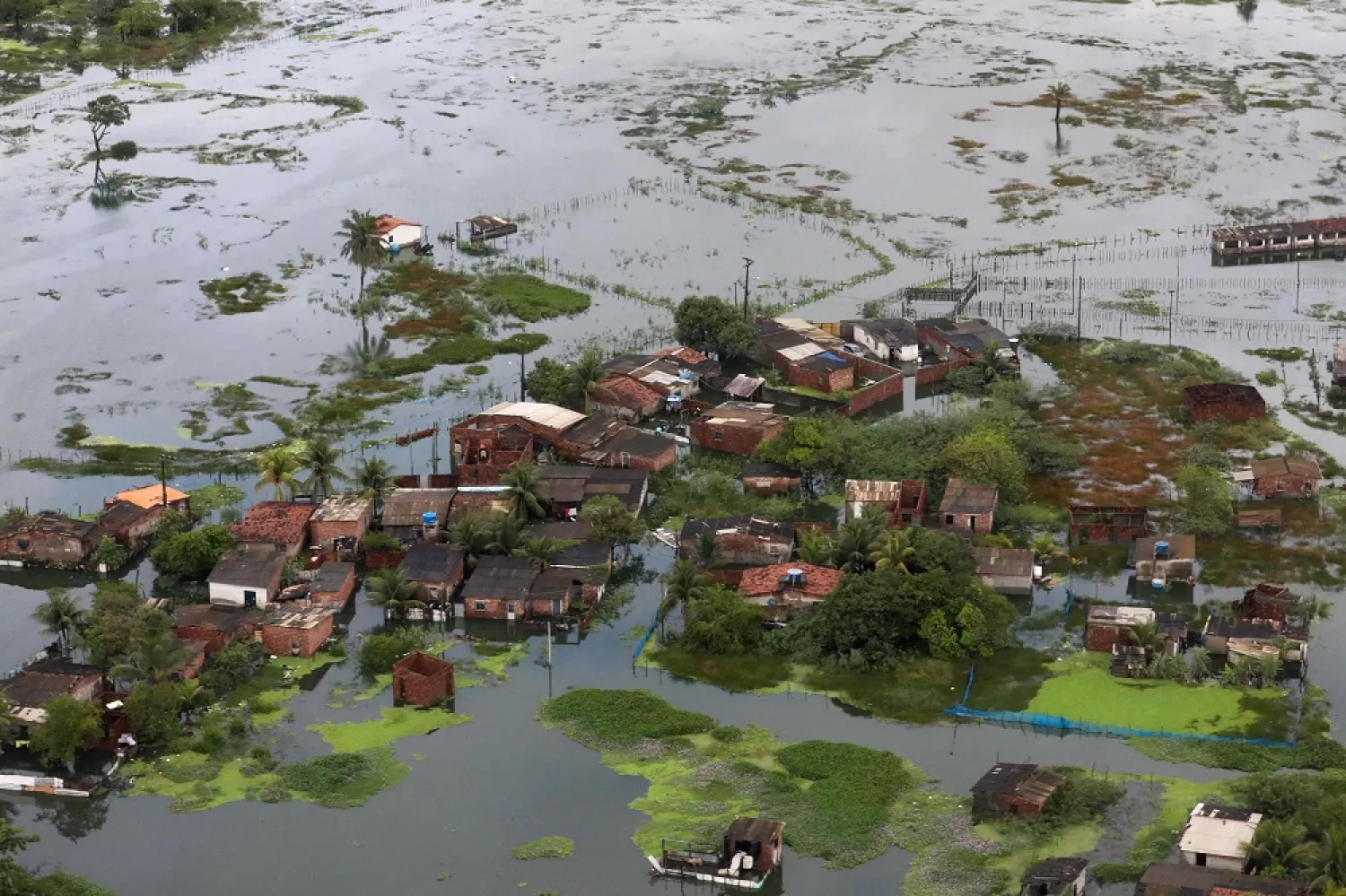 Handout picture released by the Brazilian Presidency showing an aerial view of an area in Recife, in Pernambuco State, Brazil, which was hit by floods caused by heavy rains in the last week, on May 30, 2022. (AFP Photo/Brazilian Presidency/Clauber Caetano)