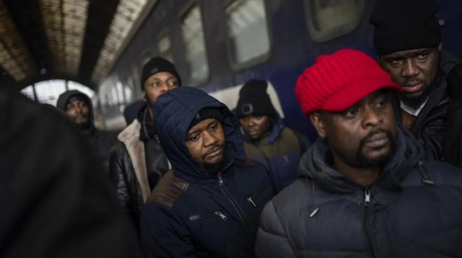 African residents in Ukraine wait at the platform inside Lviv railway station, Sunday, Feb. 27, 2022, in Lviv, west Ukraine. (AP)
