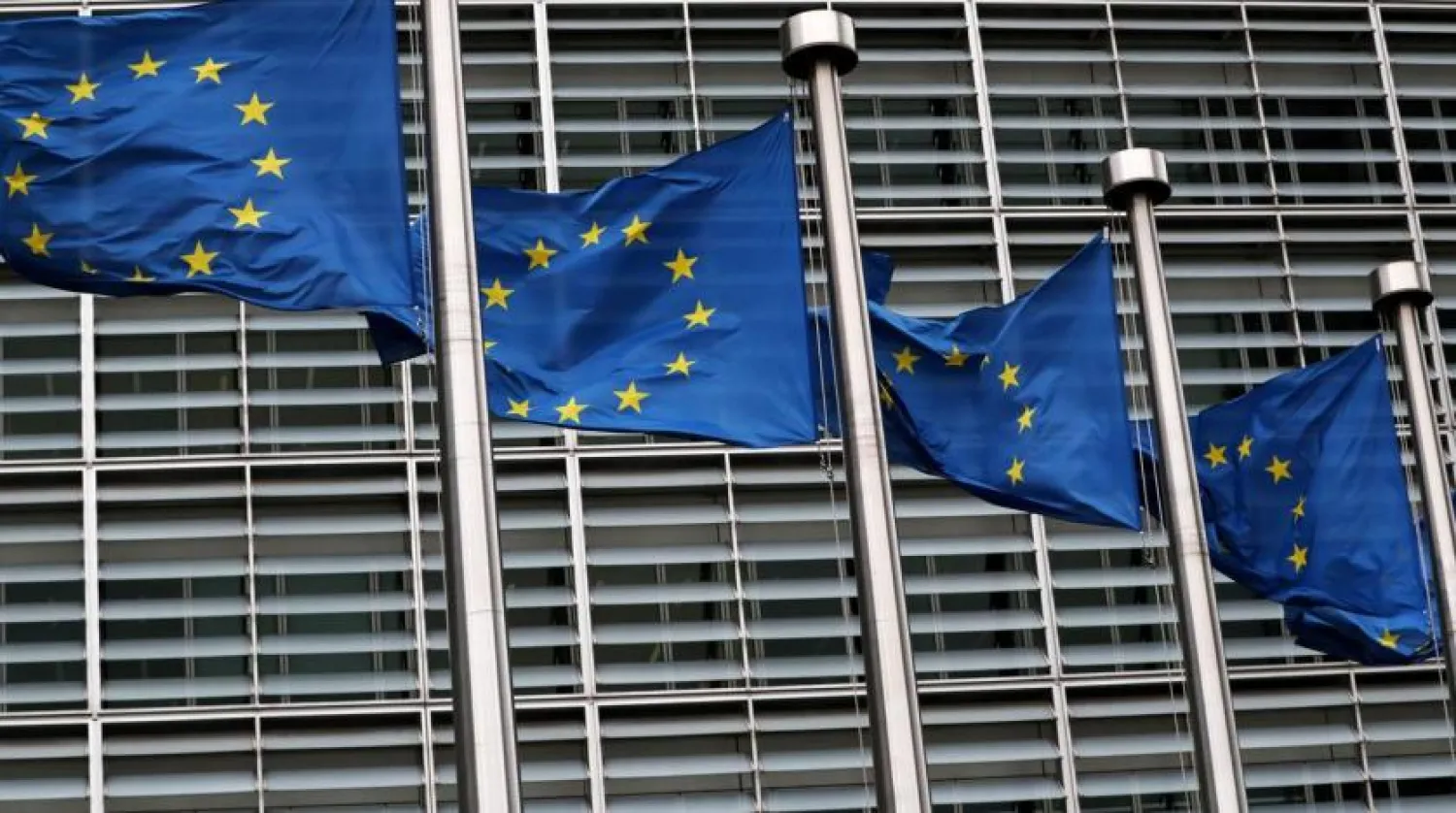 FILE PHOTO: European Union flags fly outside the European Commission headquarters in Brussels, Belgium, March 6, 2019. REUTERS/Yves Herman/File Photo