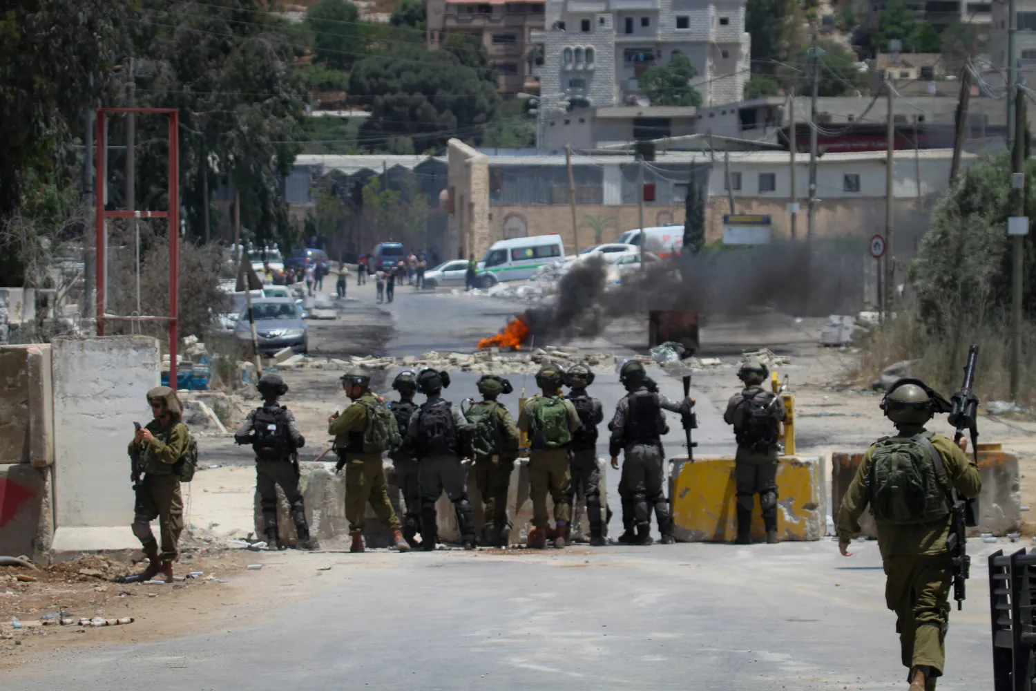 Palestinian protester hurls stones towards Israeli troops during clashes at a protest in the West Bank village of Beita, near Nablus on June 08, 2021. Photo by Nasser Ishtayeh/Flash90
