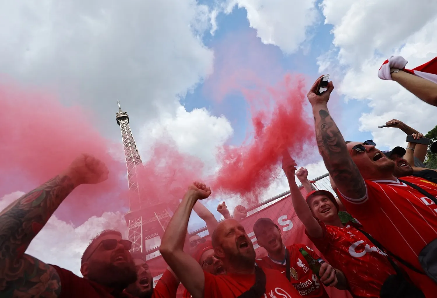 Football - Champions League - Final - Fans gather in Paris for Liverpool v Real Madrid in the Champions League Final - Paris, France - May 28, 2022 Liverpool fans gather in front of the Eiffel Tower ahead of the Champions League final. (Reuters)