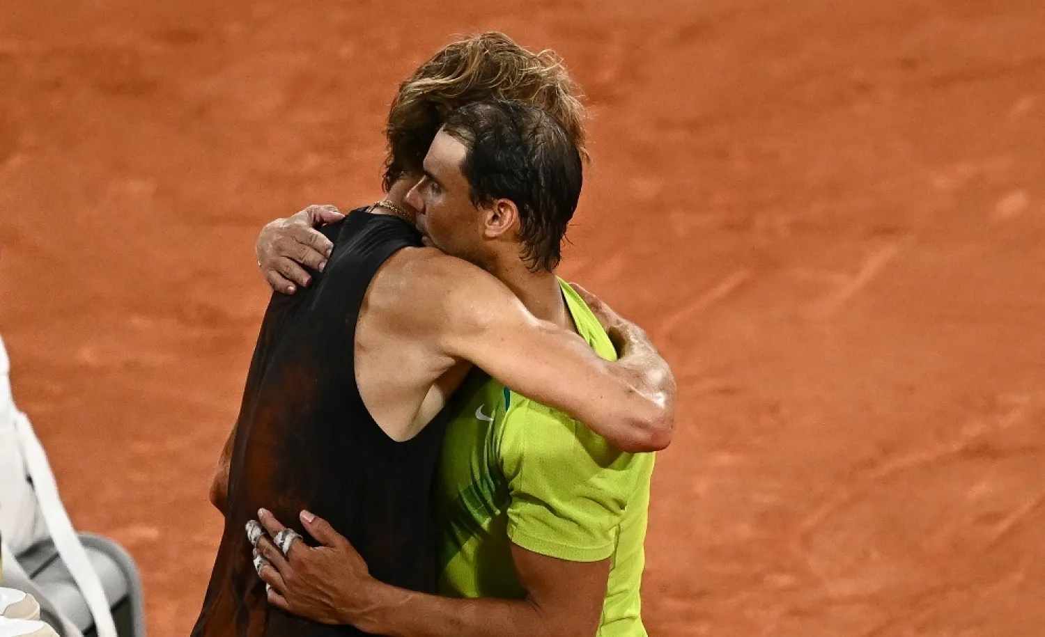 Germany's Alexander Zverev (L) embraces Spain's Rafael Nadal after being injured during his men's semi-final singles match on day thirteen of the Roland-Garros Open tennis tournament at the Court Philippe-Chatrier in Paris on June 3, 2022. (AFP) 