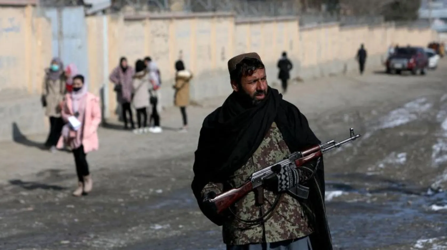 A Taliban fighter guards a street in Kabul, Afghanistan, December 16, 2021. (Reuters)

