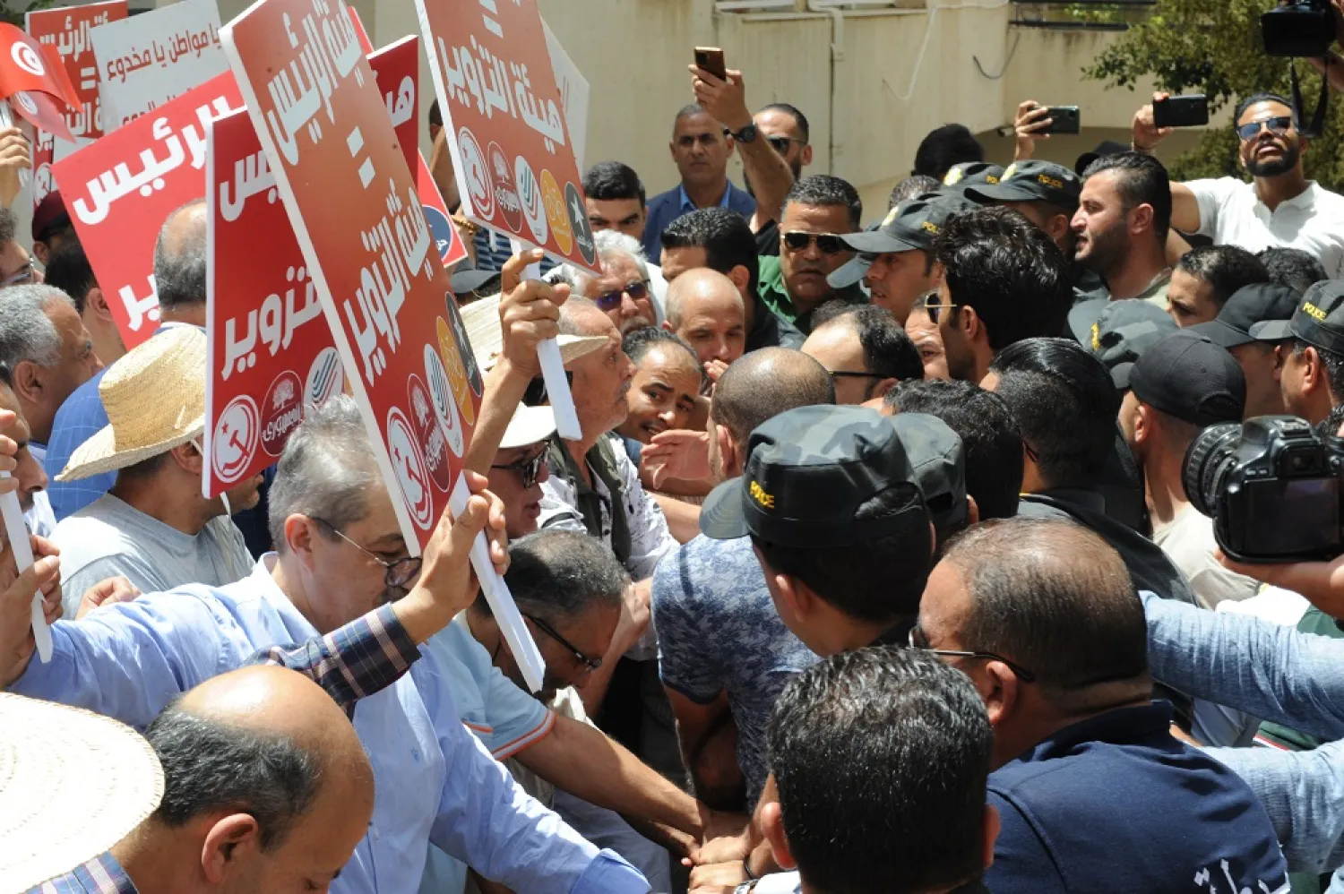 04 June 2022, Tunisia, Rades: Security forces supporters of opposition parties as they participate in a demonstration at the headquarters of the ISIE (Independent Supreme Electoral Authority). (dpa)