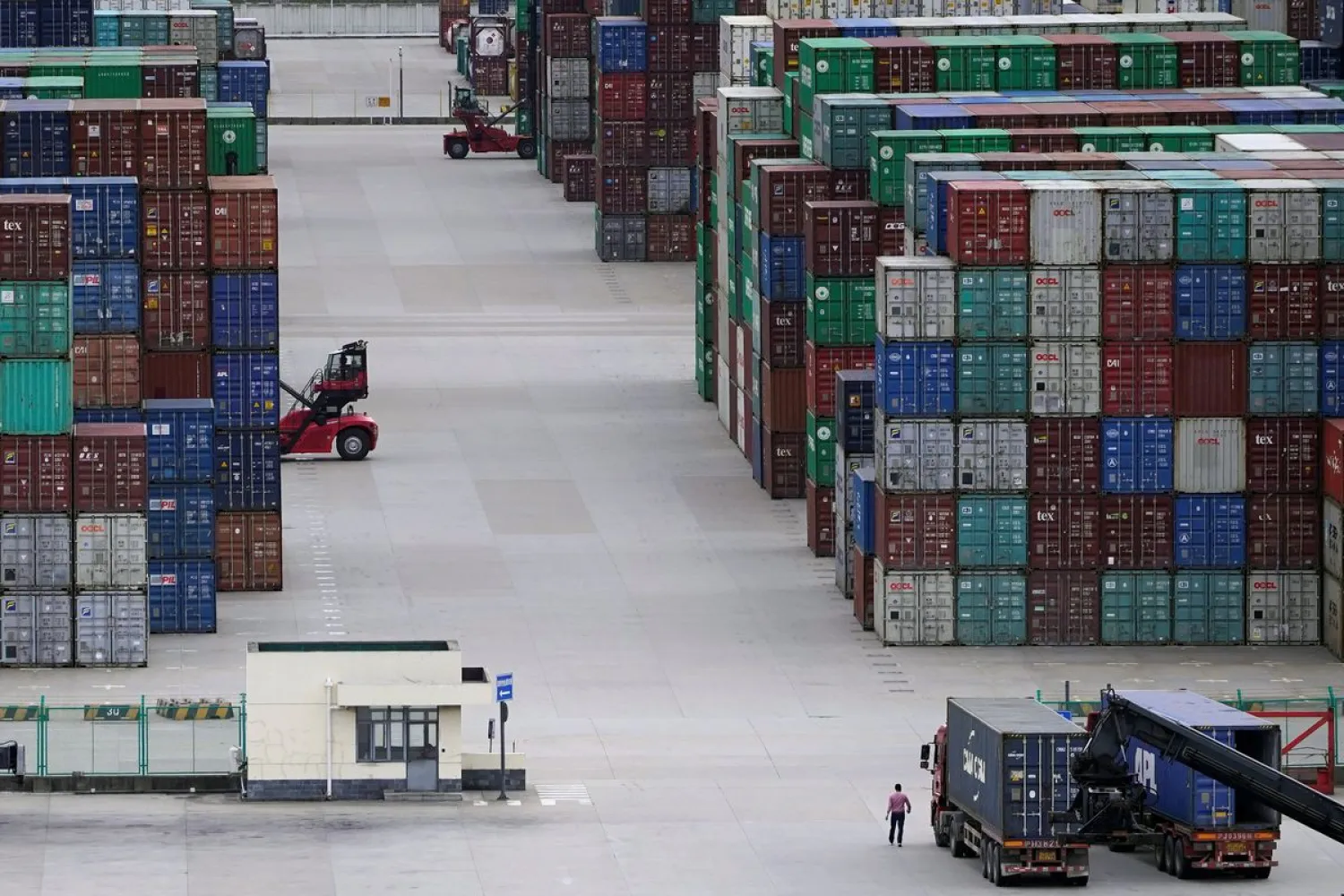 Containers are seen at the Yangshan Deep-Water Port in Shanghai, China October 19, 2020. REUTERS/Aly Song/File Photo