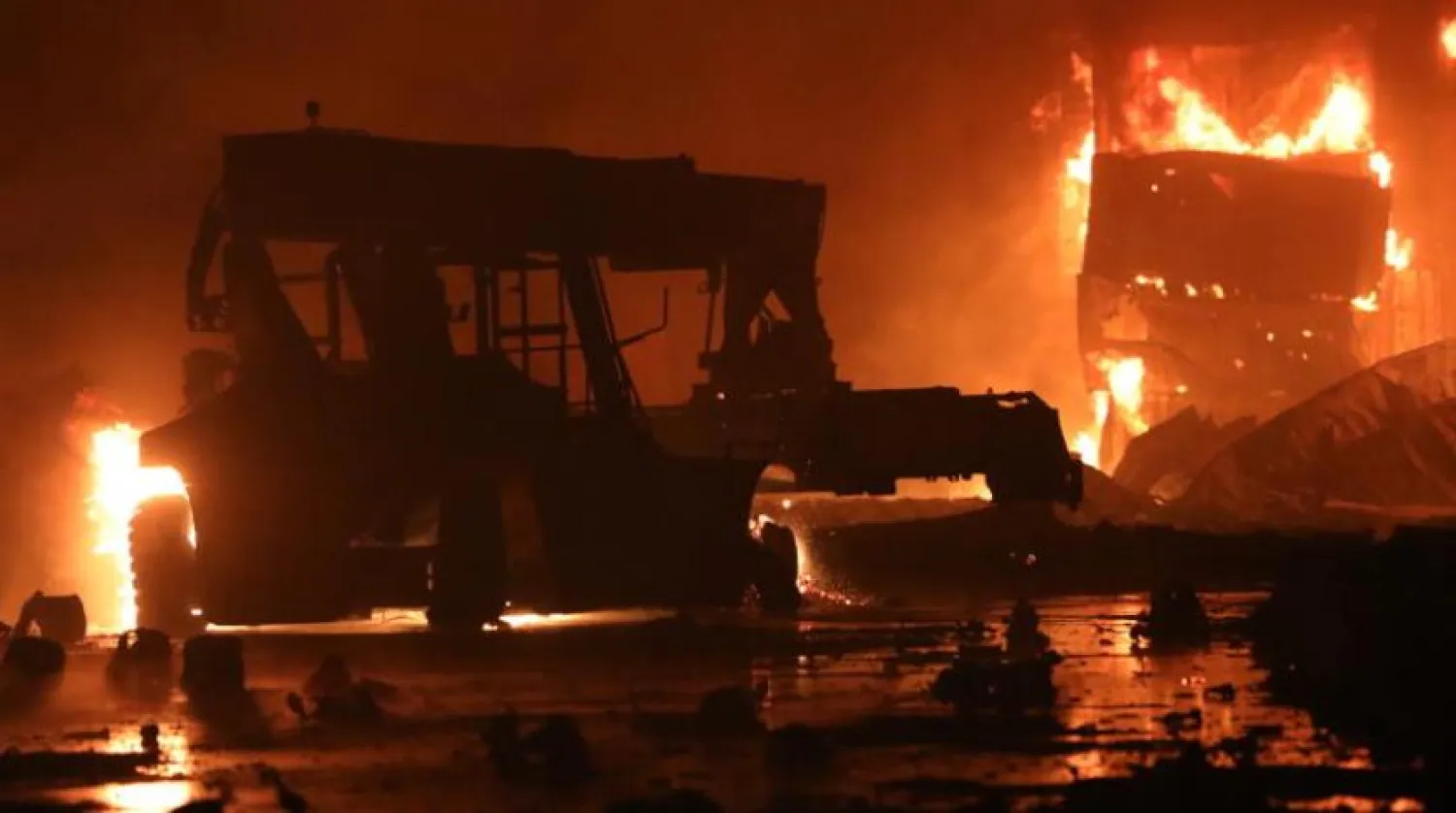 A fire rages at the BM Inland Container Depot, a Dutch-Bangladesh joint venture, in Chittagong, 216 kilometers southeast of capital, Dhaka, Bangladesh, early Sunday, June 5, 2022. (AP Photo)