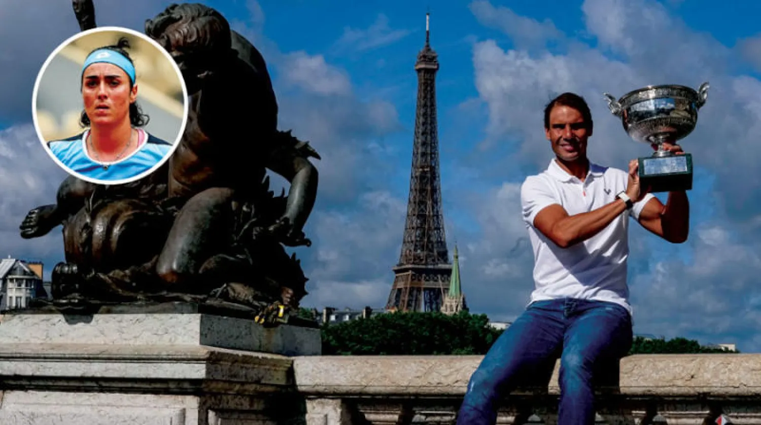 نادال يحتفل بكأس رولان غاروس بين معالم باريس (أ.ب)  -  أنس جابر (د.ب.أ)