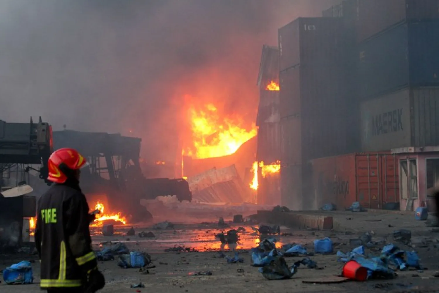 Firefighters try to extinguish a fire that broke out at a container storage facility in Sitakunda in southern Bangladesh on June 5, 2022. (AFP)
