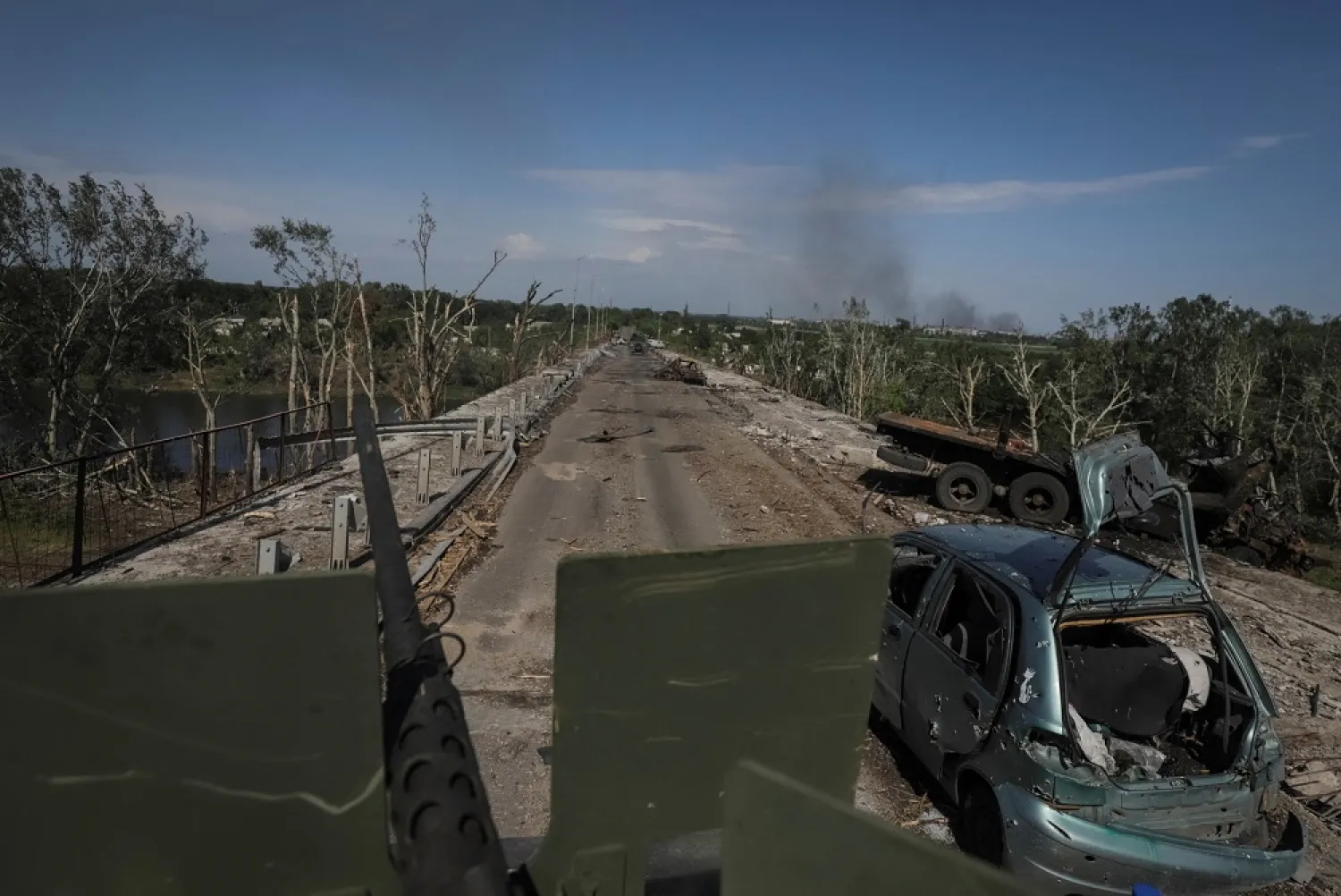 Members of a foreign volunteers unit which fights in the Ukrainian army drive on a military vehicle, as Russia's attack on Ukraine continues, in Sievierodonetsk, Luhansk region Ukraine June 2, 2022. Picture taken June 2, 2022. (Reuters)
