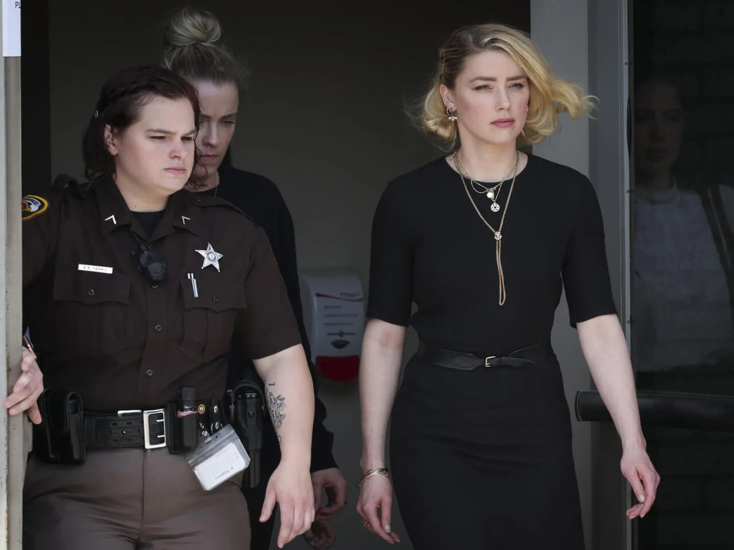 Amber Heard leaving the Fairfax County Courthouse after the verdict in the defamation case filed against her by her ex-husband Johnny Depp WIN MCNAMEE GETTY IMAGES/AFP/File
