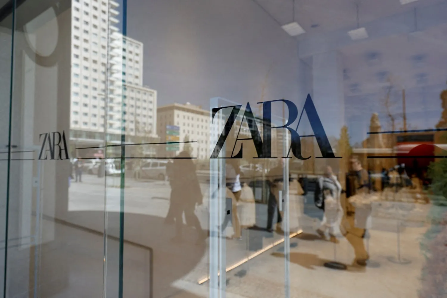 Zara's logo is displayed on a window, at one of the company's largest stores in the world, in Madrid, Spain, April 7, 2022. (Reuters)