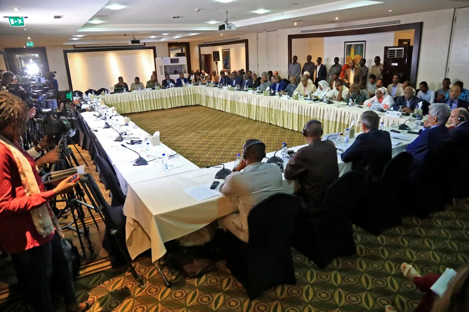Representatives of the tripartite mechanism which includes the United Nations Integrated Transition Assistance Mission in Sudan (UNITMAS), the African Union (AU) and the Intergovernmental Authority on Development (IGAD), in the Sudanese capital Khartoum on June 8, 2022. (AFP) 