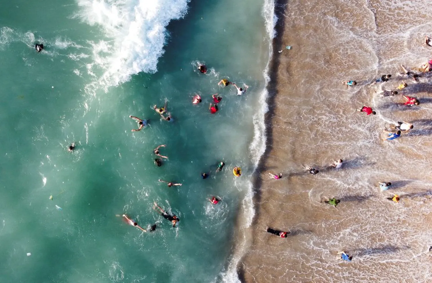 Palestinians enjoy the beach in Gaza City June 8, 2022. Picture taken June 8, 2022 with a drone. REUTERS/Mohammed Salem