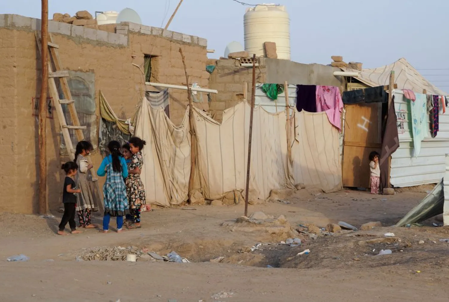 Girls play at a makeshift camp for internally displaced people (IDPs) in the Marib province, Yemen May 10, 2021. (Reuters)
